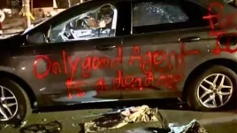 minneapolis-riot-vehicle-vandalized-ice-threat.webp